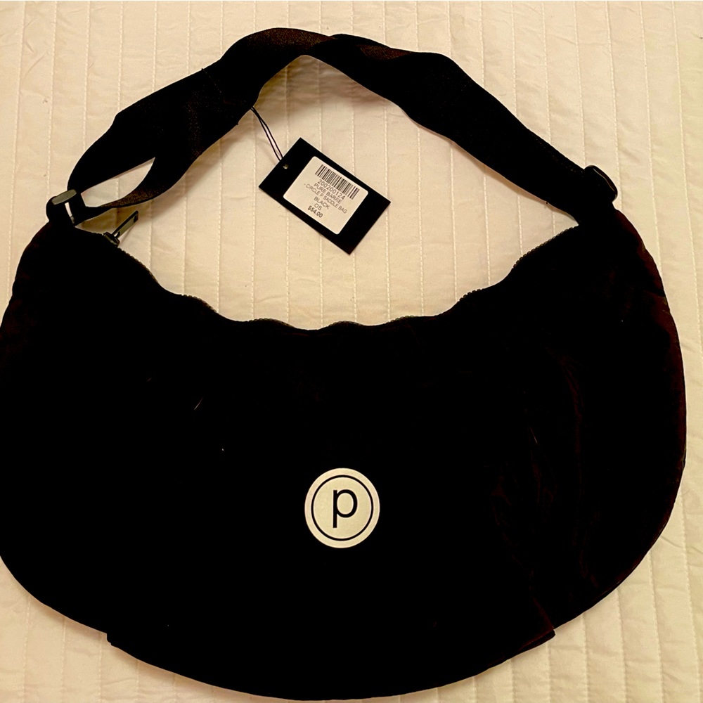 Pure Barre Circle P Saddle Bag- New with tag. Adjustable strap & zip top.